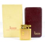 RONSON; a 9ct gold mounted lighter with engine turned decoration and with engraved initials SN,