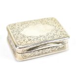 A late Victorian hallmarked silver snuff box of rounded rectangular form, with foliate scroll