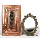 An oval mirror with cast iron foliate motif surround, 47 x 36cm, and a rectangular beaten copper