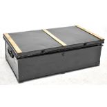 A black painted safety lock box with brass plate decoration, length 60cm.