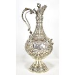 ELKINGTON & CO; an Edward VII hallmarked silver Armada jug, heavily decorated in relief and with