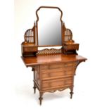An elm mirror back dressing table with carved and pierced detail, two drawers to the upper section