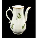 WORCESTER; an 18th century first period lobed baluster coffee pot painted with leaves, buds and