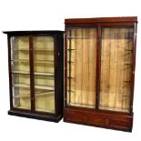 Two late 19th/early 20th century glazed mahogany shop display cabinets with later shelves, the