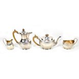 HORACE WOODWARD & CO LTD; a George V hallmarked silver four piece tea service, each of plain form