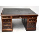 A Victorian mahogany nine drawer pedestal partner's desk, with leather top and extending pull-out