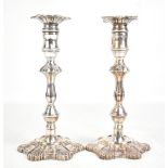 DJS; a pair of Elizabeth II hallmarked silver candlesticks of Georgian form, with fixed sconces