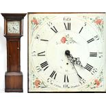AJ HELM OF ORMSKIRK; an oak cased longcase clock, the painted dial set with Roman numerals and
