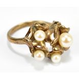 A 9ct yellow gold and pearl set ring, size O, approx 4.8g.