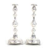 A pair of large late Victorian hallmarked silver Shabbat candlesticks with floral embossed