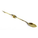 GORHAM; a sterling silver gilt olive spoon, the handle modelled as a branch with cast olive and