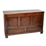 An 18th century oak coffer with panel front above two drawers, width 139cm.