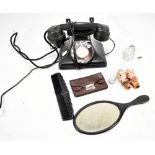 A vintage bakelite telephone, a Georgian silver tablespoon with repoussé bowl and chased handle, etc