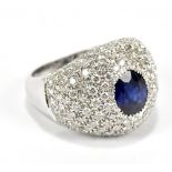 An impressive 18ct white gold and sapphire cluster ring, the central sapphire weighing approx 2ct