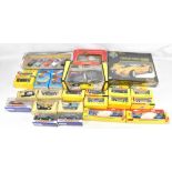 A collection of assorted Burago and further die cast toys, also a Burago die cast metal kit for