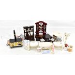 A collection of dolls house bathroom and kitchen furniture including bath, toilet, his and hers