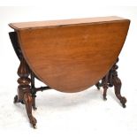 A Victorian mahogany Sutherland table with oval flaps, lobed turned end supports and scrolling feet,