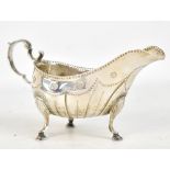 MATTHEW WEST; an 18th century Irish hallmarked silver sauce boat with panelled decoration and raised