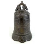 A Chinese bronze temple bell with stylised dragon hanging bracket and archaic style decoration (