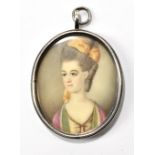 A watercolour on ivory, oval portrait miniature, study of a lady, 3.5 x 3cm, framed.