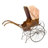 A reproduction carved walnut dog carriage with folding canopy and oak arms, length 139cm.