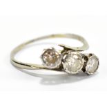 An 18ct white gold and platinum set three stone diamond ring, size L, approx 1.9g.