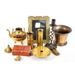 A small collection of metalware including shell case, trench art, candle holder, etc.