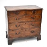 A Georgian mahogany chest of two short over three long drawers, raised on bracket feet, length