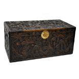 A rectangular carved camphor wood blanket box.