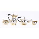 WALKER & HALL; a hallmarked silver four piece tea service with cast rims, Sheffield 1951, approx