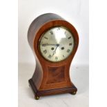 An Edwardian mahogany and boxwood strung balloon shaped mantel clock with silvered dial set with