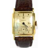 LONGINES; a gentleman's vintage yellow metal Curvex wristwatch, the rectangular dial set with