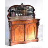 A Victorian mahogany serpentine mirror back chiffonier with two panelled doors, width 122cm.