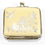 A white metal purse, with inlaid floral decoration and a swooping bird, length 6cm.