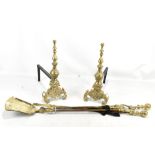 A pair of brass andirons and set of fireside companion tools (5).Additional InformationThe