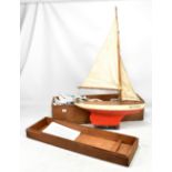 A boxed circa 1945 pond yacht 'Victory'. Footnote: This model was made from surplus material used