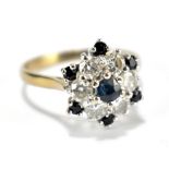 An 18ct white gold diamond and sapphire and floral set ring, size O, approx 4.2g.