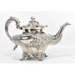 WILLIAM HUTTON & SONS; a Victorian hallmarked silver teapot, with repoussé decoration of floral