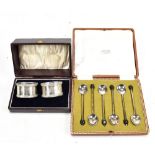 JOSEPH GLOSTER LTD; a cased pair of George V hallmarked silver napkin rings, Birmingham 1915, and