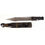 An African tribal ceremonial dagger, possibly Zimbabwean, length of blade 25.7cm, with carved grip