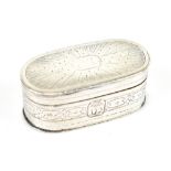 An early 19th century hallmarked silver oval vinaigrette, the hinged lid with engraved detail and