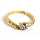 An 18ct yellow gold Art Deco diamond crossover ring, approx 0.14cts, size M/N, approx 2.5g.