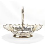 THOMAS CHAWNER (possibly); a George III hallmarked silver swing handled bread basket, with cast rim,