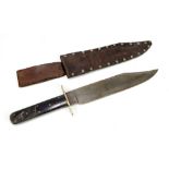 A Texas Bowie knife with bone grip set with studs to both sides, shaped blade and stud decorated