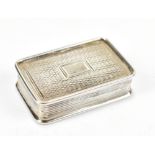 A William IV hallmarked silver vinaigrette of rounded rectangular form, with engraved cover and base