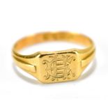 An 18ct yellow gold signet ring, engraved with stylised initials, Chester 1913, ring size O,