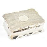 WILLIAM NEALE; an Edward VII hallmarked silver snuff box of shaped rectangular form with engine