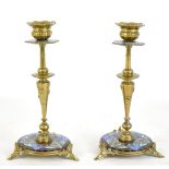 A pair of late 19th century French brass and champlevé brass candlesticks, height 21.5cm.