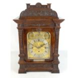 GURKHA INTEREST; a good and large late 19th century oak eight day mantel clock with carved case,