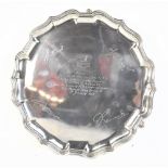 MAPPIN & WEBB; a George VI hallmarked silver salver raised on three stepped hoof feet, with